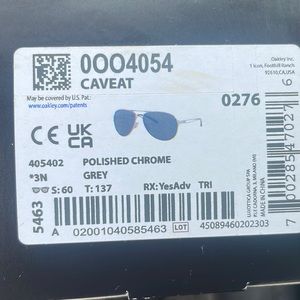 NIB Oakley Caveat Polished Crome Grey Sungalsses